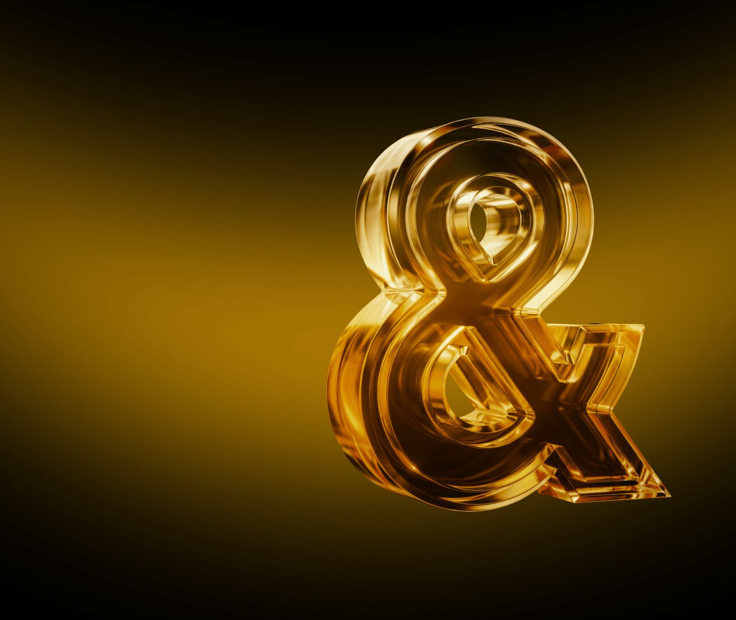 A glass ampersand sculpture lit in gold against a deep amber background
