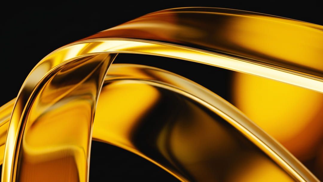 Sweeping bands of gold glass catching the light